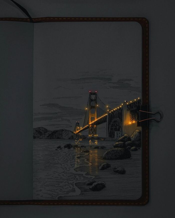 Pen and ink drawing of a glowing bridge at night with light reflections, showcasing the Ukrainian artist’s glowing ink technique.