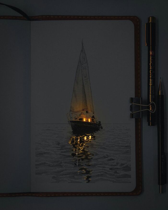 Pen and ink drawing of a sailboat on water with glowing light effects in a sketchbook by a Ukrainian artist.