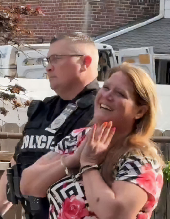 Police officer standing by as road-raged woman smiles after incident involving other driver&rsquo;s car breaks internet.