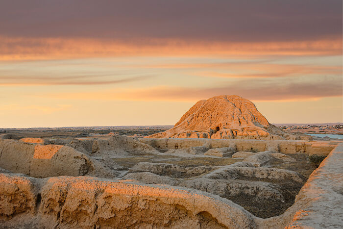Ancient archaeological site at sunset showcasing one of the stunning UNESCO treasures in a vast desert landscape.