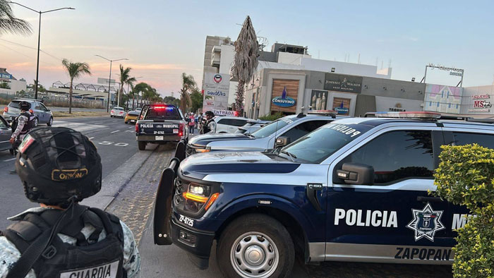 Police vehicles and officers at a crime scene where a 23-year-old influencer was fatally shot while live streaming. Police vehicles and officers at a crime scene where a 23-year-old influencer was fatally shot while live streaming.