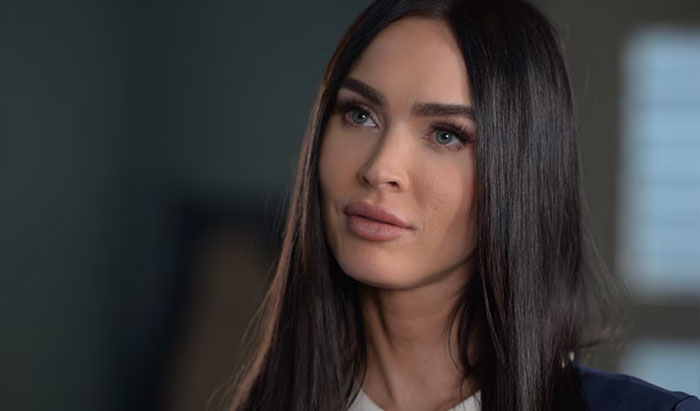 Close-up of a woman with long dark hair and clear skin, relating to celebrities called out for gross hygiene habits.