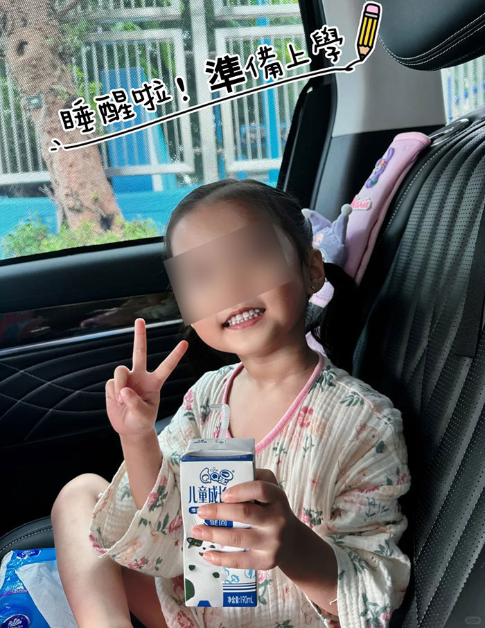 Young child sitting in car holding a drink box, related to monster mom forcing 4YO to eat, sleep, and use bathroom in car. Young child sitting in car holding a drink box, related to monster mom forcing 4YO to eat, sleep, and use bathroom in car.