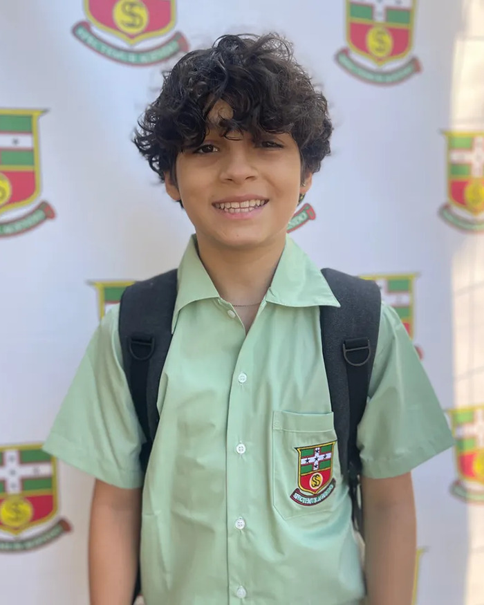 Young boy in school uniform smiling with backpack, related to after 13YO son took his own life and body freezing fundraiser. Young boy in school uniform smiling with backpack, related to after 13YO son took his own life and body freezing fundraiser.