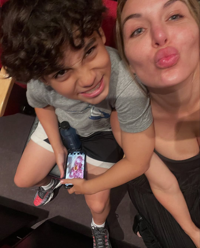 Woman and young boy smiling together, capturing a moment reflecting a mother's desperate effort to freeze her son’s body. Woman and young boy smiling together, capturing a moment reflecting a mother's desperate effort to freeze her son’s body.