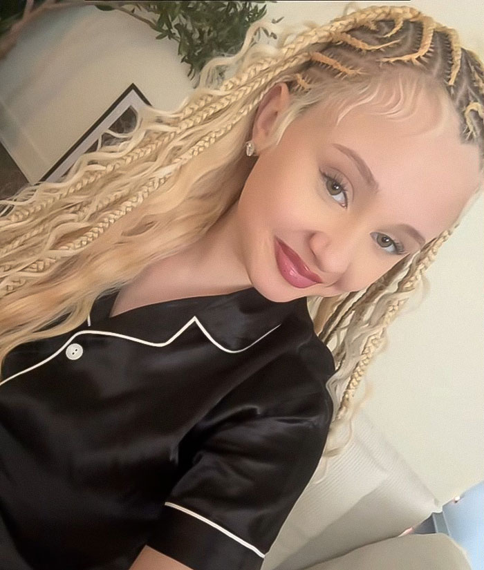 Alabama Barker with braided hair, smiling indoors in a black satin outfit, sparking buzz after weight-loss medication and bikini photoshoot Alabama Barker with braided hair, smiling indoors in a black satin outfit, sparking buzz after weight-loss medication and bikini photoshoot