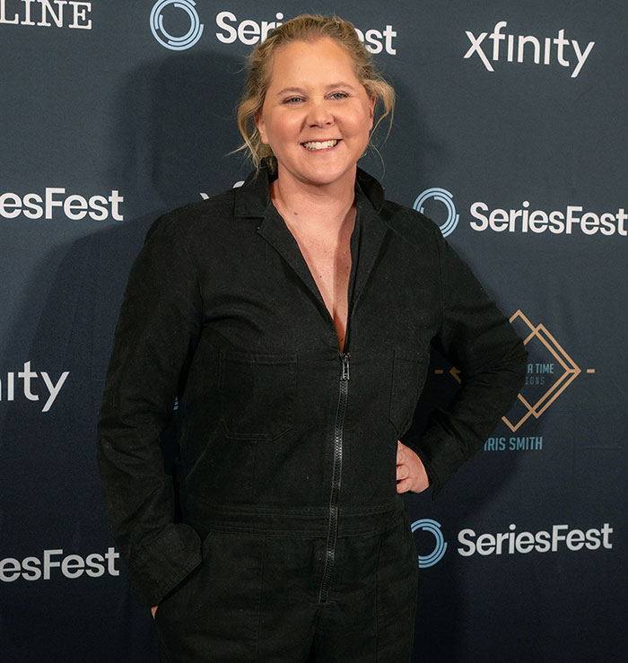 Comedian Amy Schumer smiling at SeriesFest event, highlighting the growing concern of Ozempic teeth side effects.