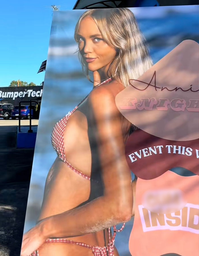 Large promotional poster of an adult content creator in a bikini, highlighting her status as an adult content creator.