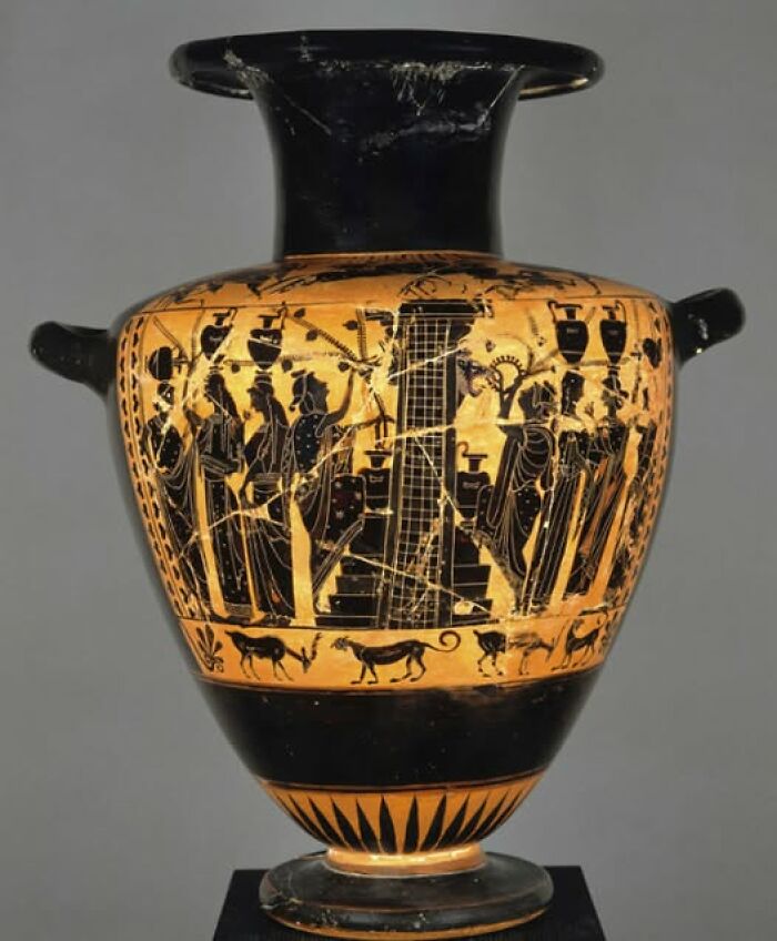 Ancient Greek pottery featuring detailed archeology and art with human figures and animals in black-figure style.