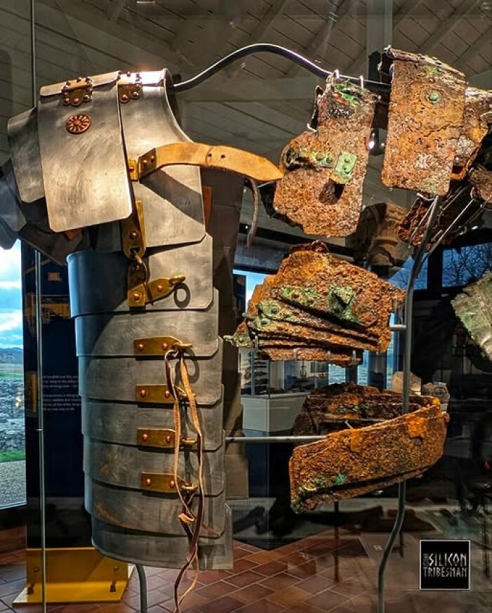 Ancient Roman armor pieces displayed in a museum highlighting archeology and art showcasing historical archaeological wonders.