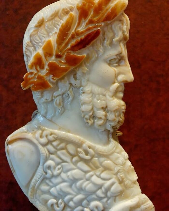 Marble bust sculpture of a bearded man wearing a laurel wreath, showcasing archeology and art craftsmanship.