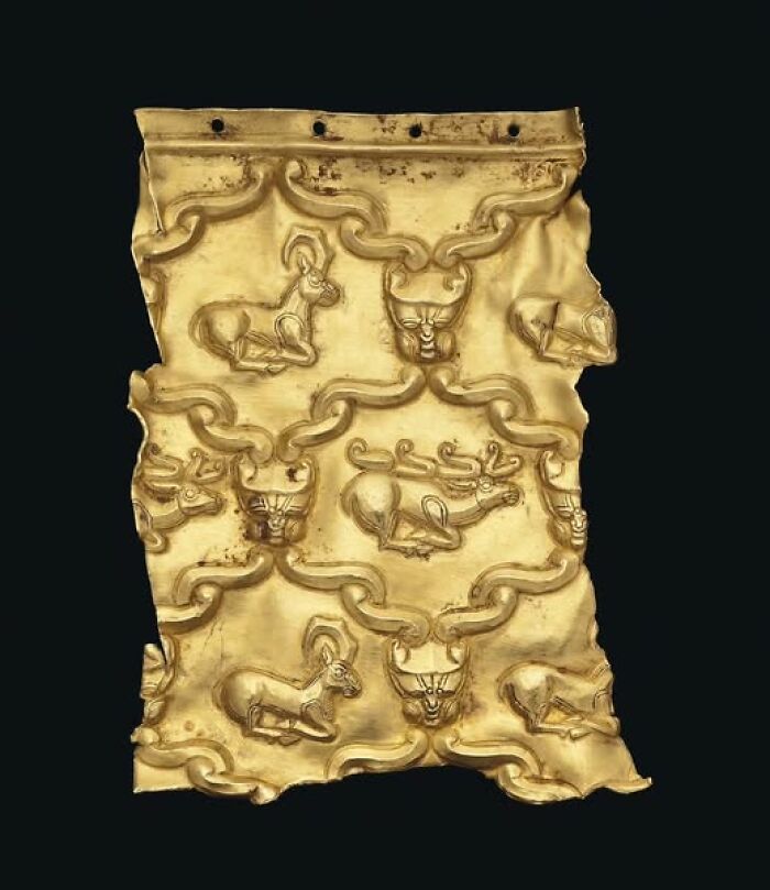 Ancient gold artifact featuring detailed animal motifs showcasing archeology and art in historical craftsmanship.