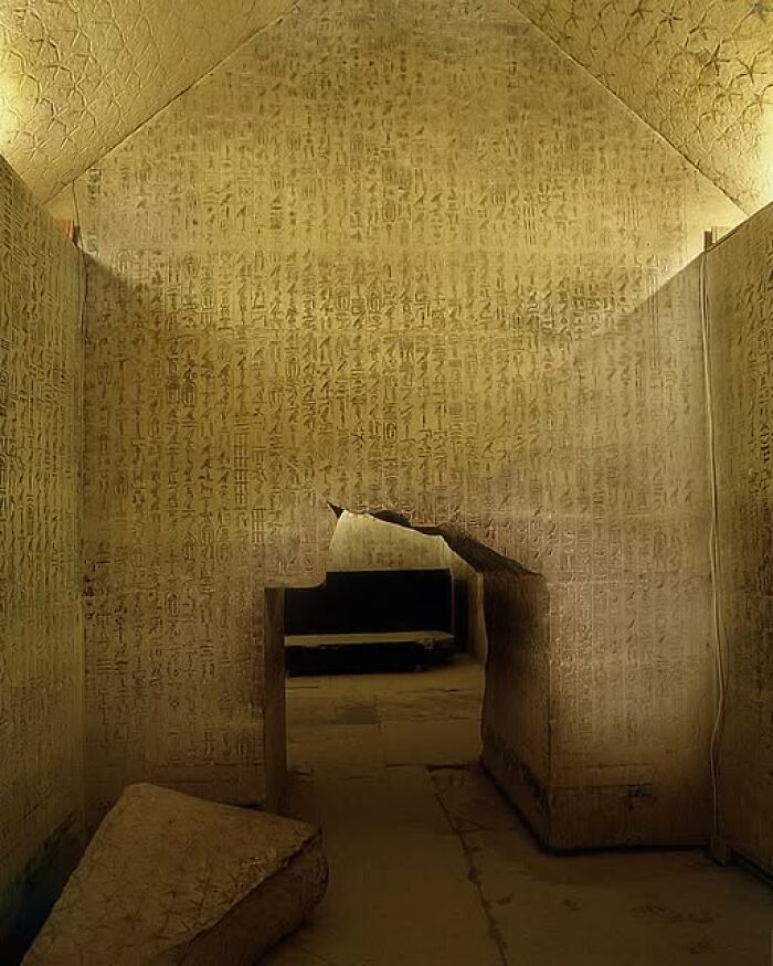 Ancient archeological site with detailed hieroglyphic carvings on walls showcasing archeology and art wonders.