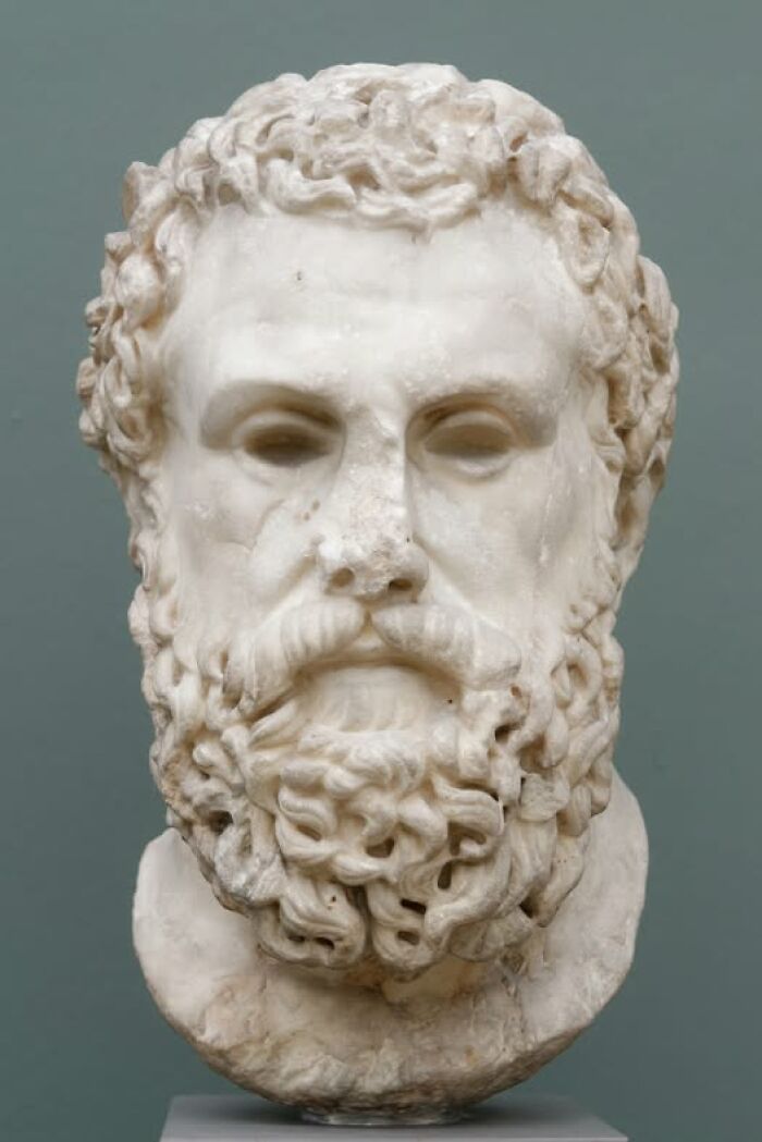 Marble bust of an ancient bearded man showcasing archeology and art in classical sculpture style.