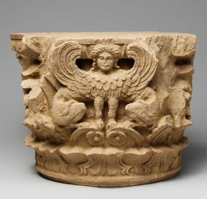 Ancient carved stone artifact featuring mythical winged figure, highlighting archeology and art in historical archeological wonders.