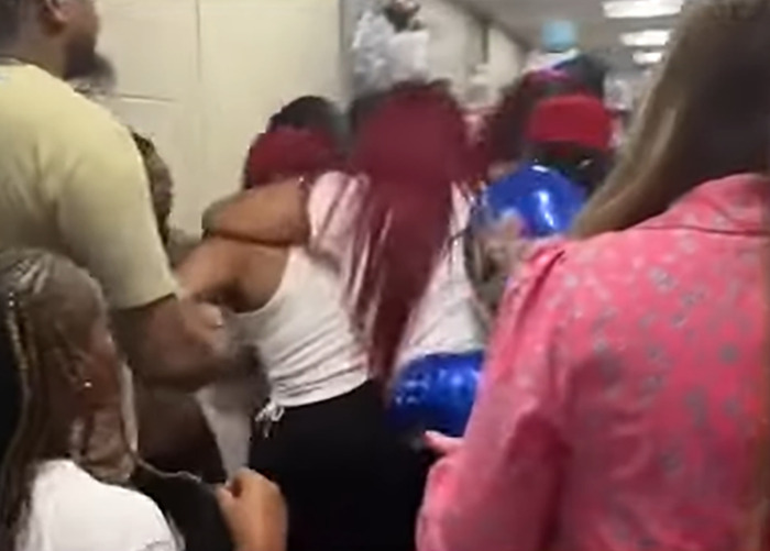 Parents in a chaotic brawl at kindergarten graduation as children try to intervene in the traumatic fight.