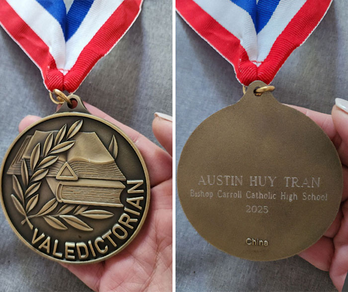 Valedictorian medal showing front with books and laurel and back with engraved name and school, highlighting punishment controversy.