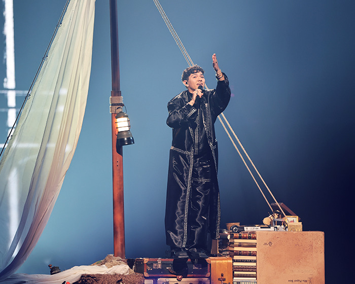 Singer performing on stage with nautical props during Austria Eurovision 2025 victory stunning performance.