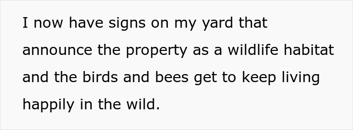 Signs on a yard announcing certified wildlife habitat with birds and bees living happily in overgrown weeds.