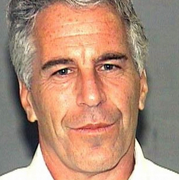 Close-up of a middle-aged man with gray hair and a slight smile illustrating massive awkward truths ignored by everyone.