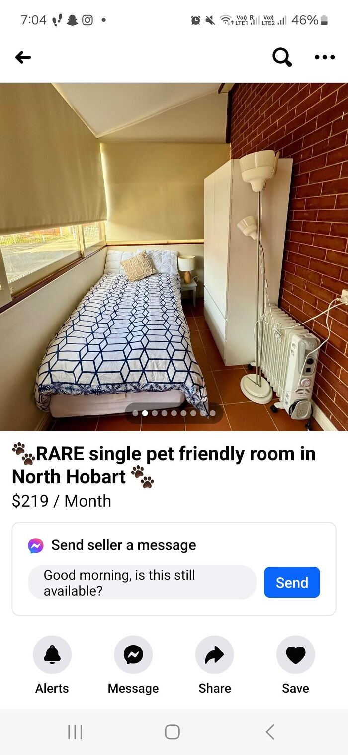 Small single bedroom with brick wall, heater, and wardrobe, illustrating bad landlords who made renting a total nightmare.