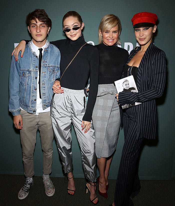 Gigi and Bella Hadid posing with family members at an event, highlighting secret sister revelation from their father. Gigi and Bella Hadid posing with family members at an event, highlighting secret sister revelation from their father.