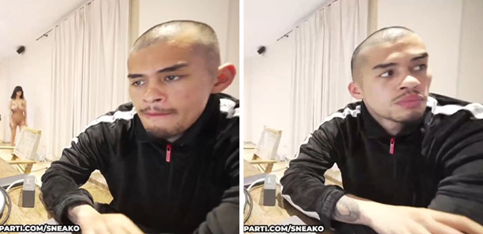 Kanye West's friend quickly covers camera as Bianca Censori walks in wearing minimal clothing in a casual room setting.