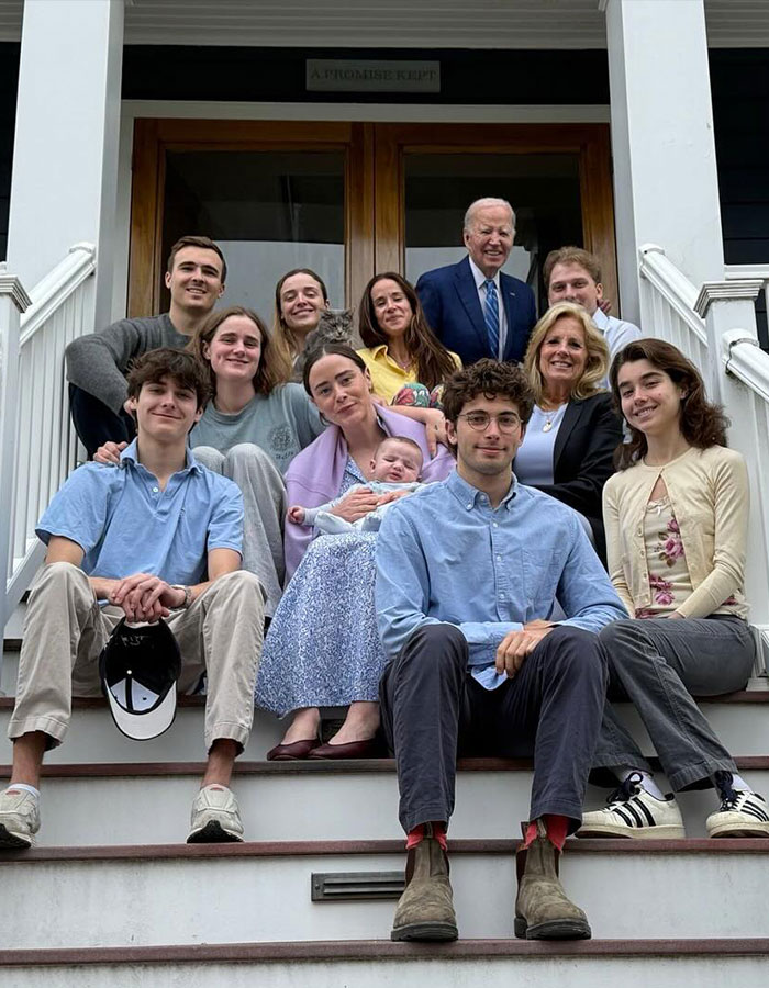 Former President Biden with family on porch steps, amid news of aggressive prostate cancer and reported bone spread.