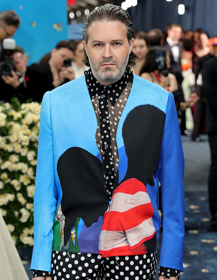 Man wearing bold blue and polka dot outfit with graphic print, showcasing one of the biggest fashion fails from the Met Gala 2025.