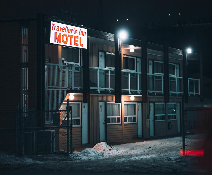Traveller's Inn Motel illuminated at night, representing one of the weirdest ways people earned some quick money.