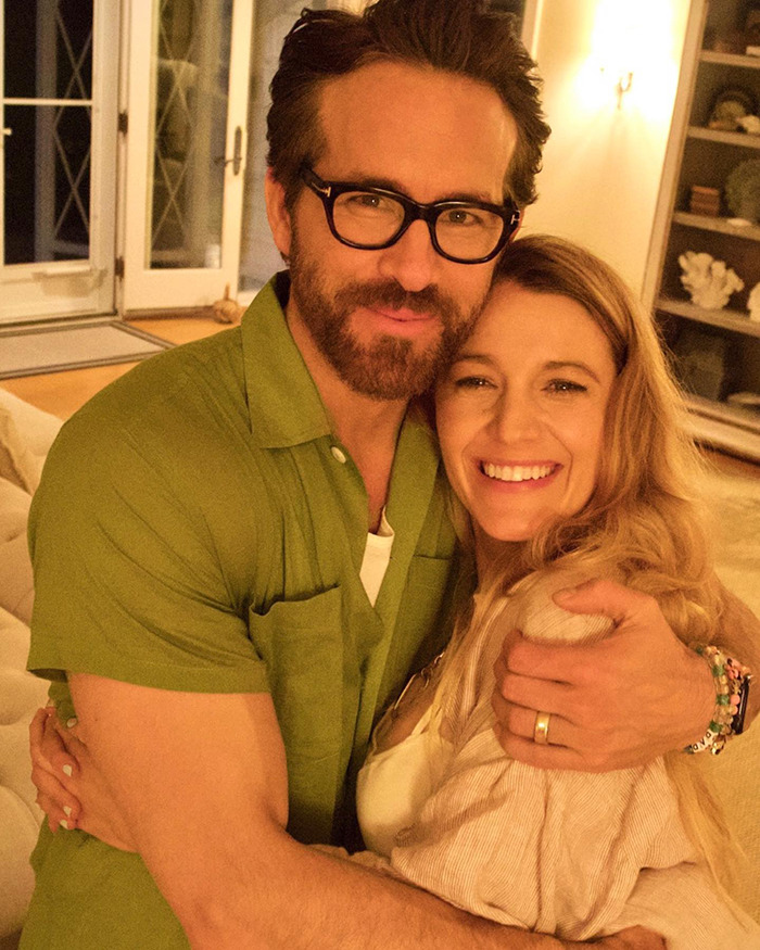Ryan Reynolds and Blake Lively embracing warmly indoors, related to Scarlett Johansson lawsuit news.