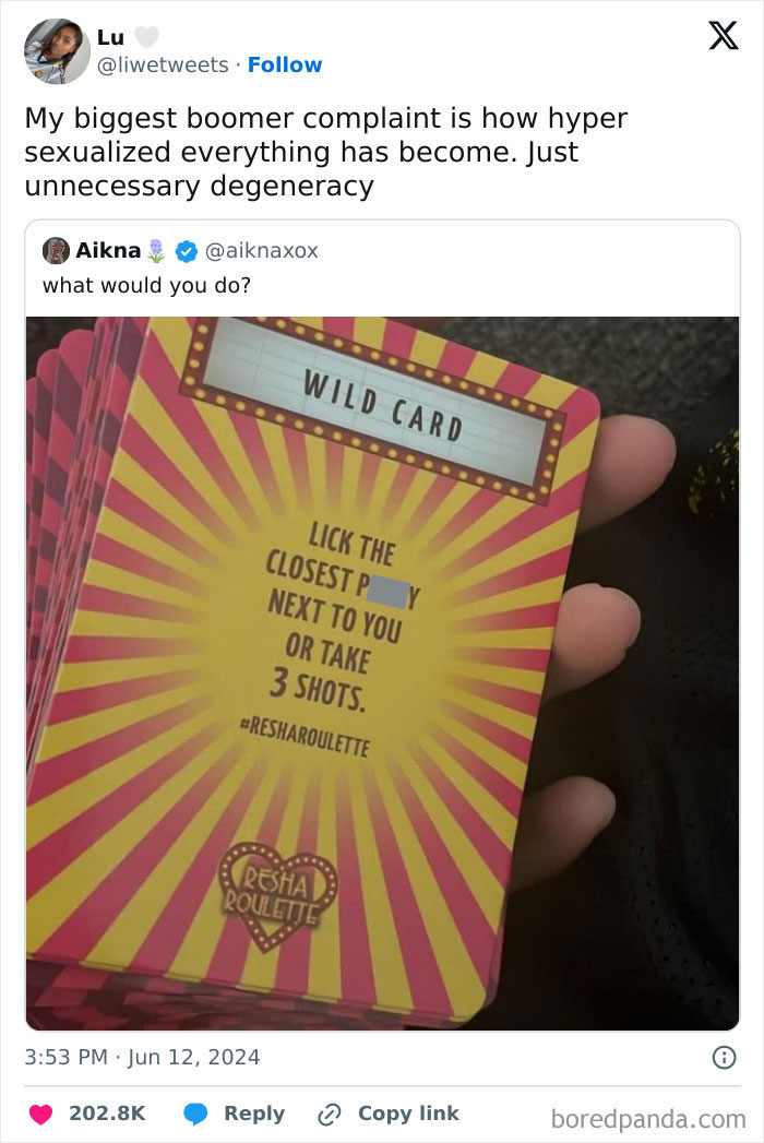Tweet about boomer complaints with a close-up of a colorful wild card from a party game held in hand.