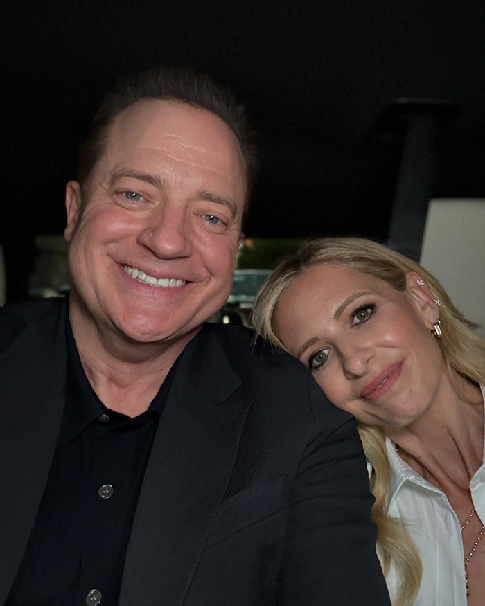 Brendan Fraser smiling with a woman, showing his slimmed down physique at a cancer gala event.