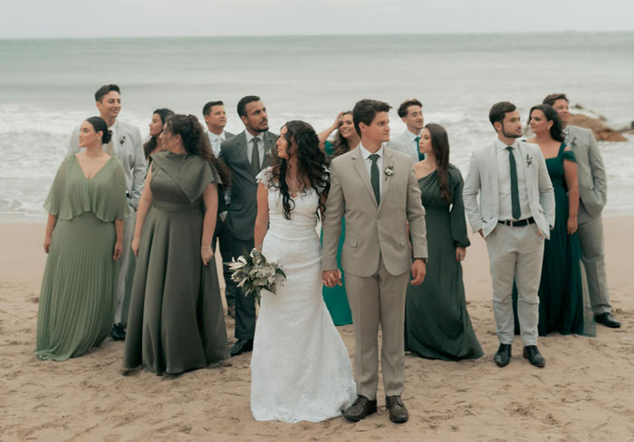 Bride and groom with wedding party on beach, capturing couple and maid of honor during wedding planning moments. Bride and groom with wedding party on beach, capturing couple and maid of honor during wedding planning moments.