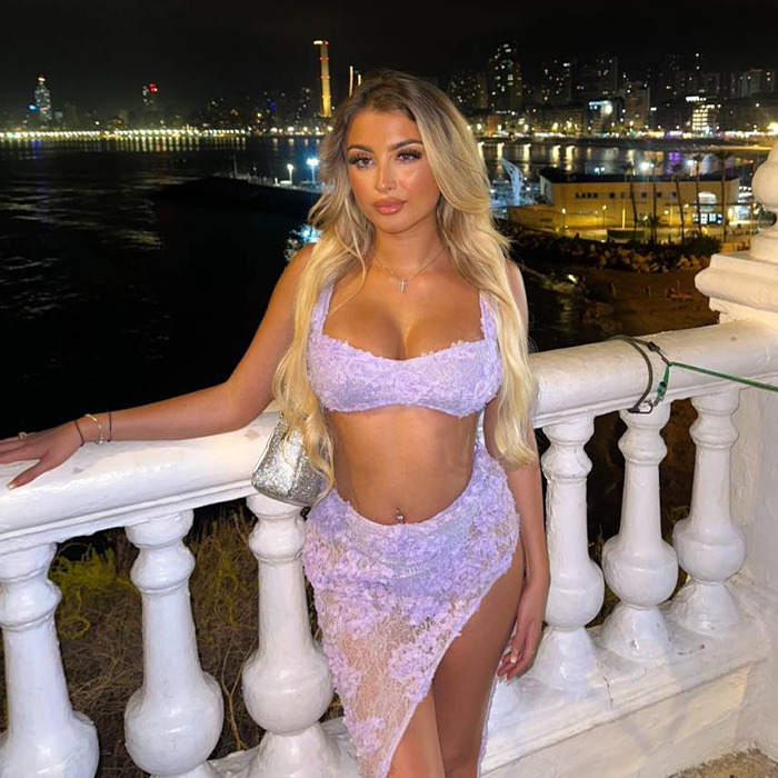 Young woman posing by a waterfront at night, linked to Dubai prison warnings about conditions in the UAE. Young woman posing by a waterfront at night, linked to Dubai prison warnings about conditions in the UAE.