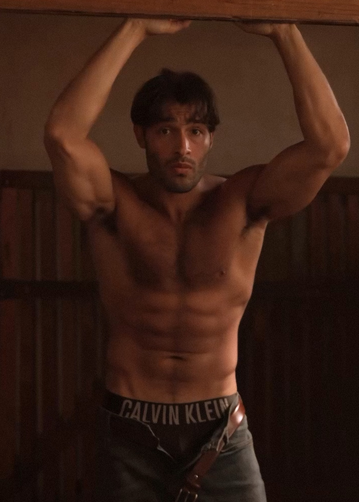 Sam Asghari shirtless showing muscular abs and arms during an intense workout, sparking Britney Spears fans' attention.