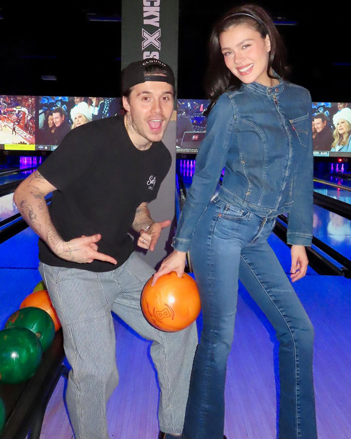 Nicola Peltz at a bowling alley with her husband Brooklyn Beckham, amid wedding rumors involving Victoria Beckham.