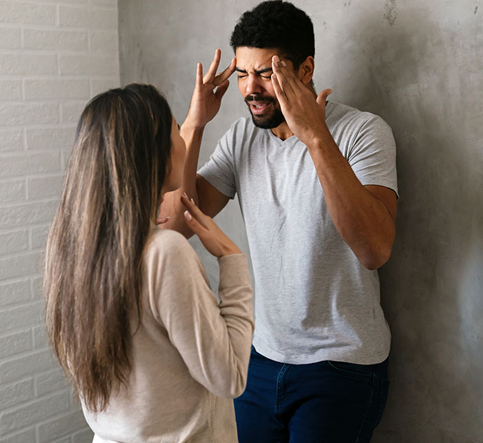 Couple arguing in a tense moment, depicting conflict related to woman served with divorce papers after helping sister-in-law&rsquo;s kids.