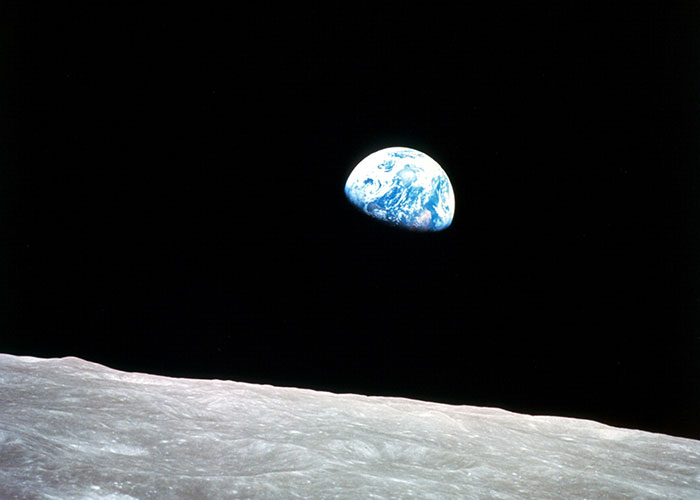 View of Earth rising above the moon's surface, illustrating surprising things people can't believe they explained to another adult.