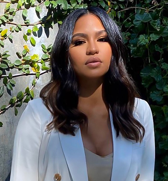Cassie Ventura posing outdoors with wavy hair and a white blazer, related to Diddy trial jury and freak off parties. Cassie Ventura posing outdoors with wavy hair and a white blazer, related to Diddy trial jury and freak off parties.