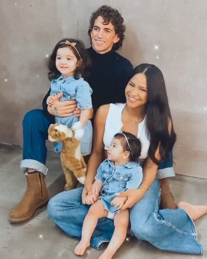 Cassie Ventura with her husband and two children, sharing a joyful family moment in casual attire. Cassie Ventura with her husband and two children, sharing a joyful family moment in casual attire.