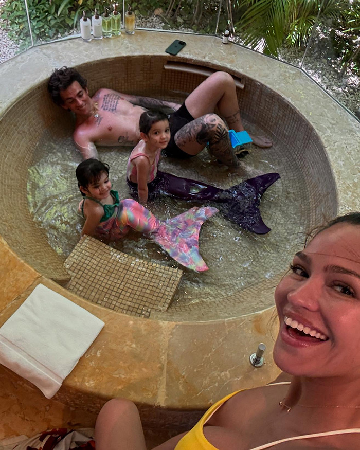 Cassie Ventura's husband and children enjoy time together in a small pool, with kids wearing colorful mermaid tails. Cassie Ventura's husband and children enjoy time together in a small pool, with kids wearing colorful mermaid tails.