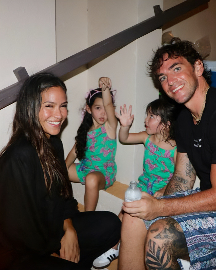 Cassie Ventura's husband smiling with children indoors, showing support and unity in a casual family moment. Cassie Ventura's husband smiling with children indoors, showing support and unity in a casual family moment.
