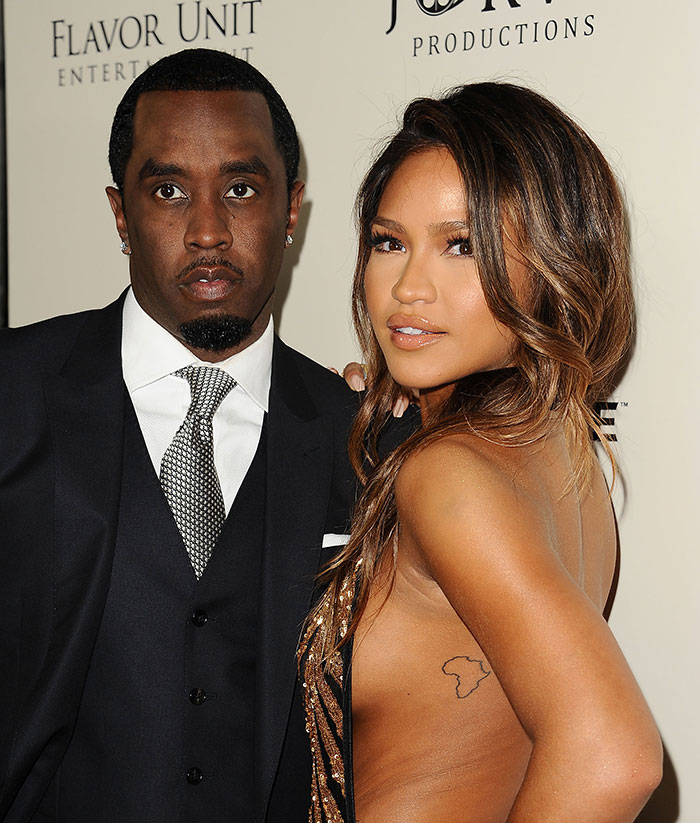 Diddy and Cassie Ventura posing together at an event, related to graphic photos from freak off parties. Diddy and Cassie Ventura posing together at an event, related to graphic photos from freak off parties.
