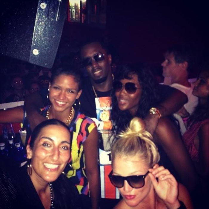Group of people at a party, with Diddy and Cassie Ventura among them, in a lively social setting. Group of people at a party, with Diddy and Cassie Ventura among them, in a lively social setting.