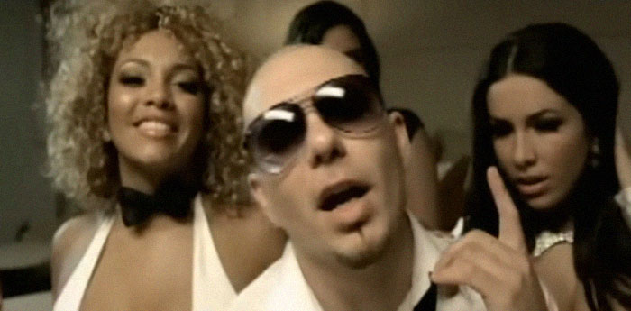 A man wearing sunglasses with two women, illustrating netizens revealing what celebrities were like before fame.