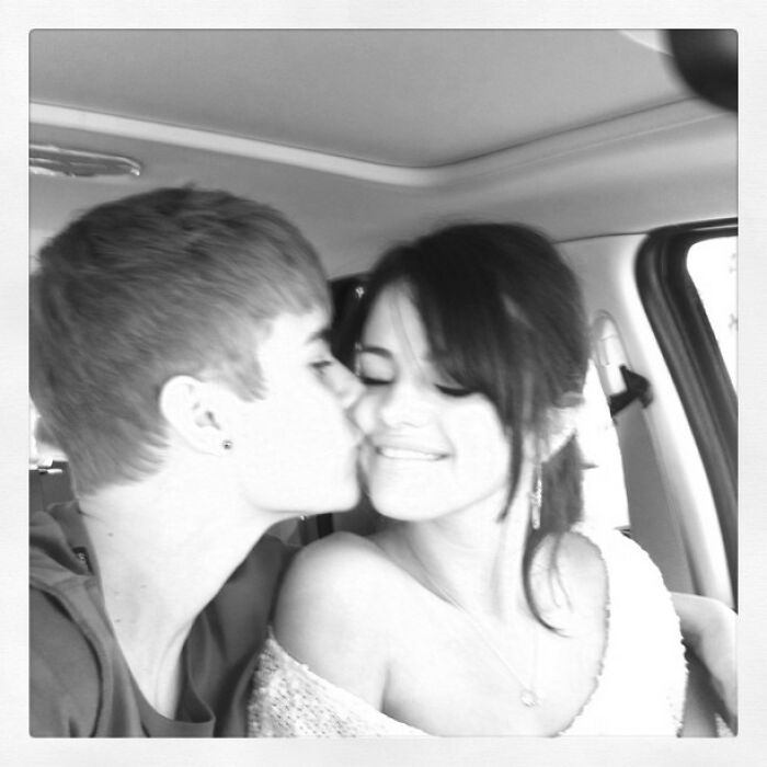 Young celebrities sharing a sweet moment in a nostalgic Instagram post from way back in the day inside a car.