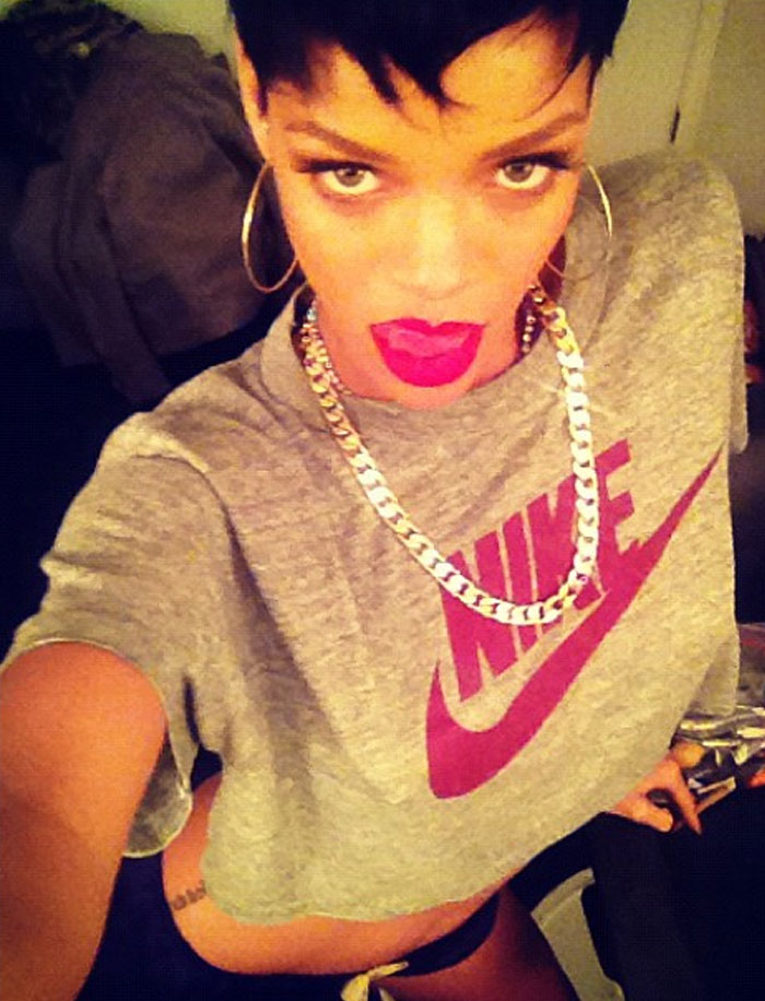 Celebrity selfie showing fashion from way back in the day with bold lipstick and casual Nike clothing.