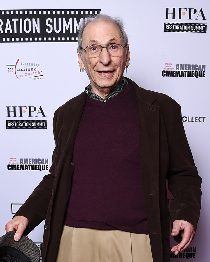 Older man posing at HFPA Restoration Summit event, related to fans heartbroken after another Cheers star's passing.