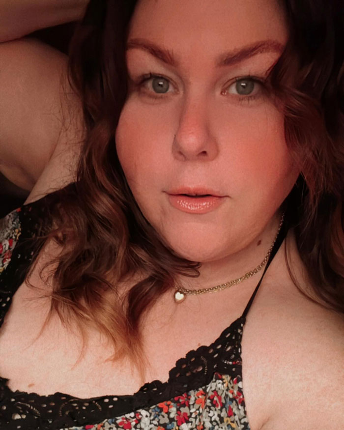 Chrissy Metz showing off her slimmed-down look after revealing secrets to 100lbs weight loss in a floral top.